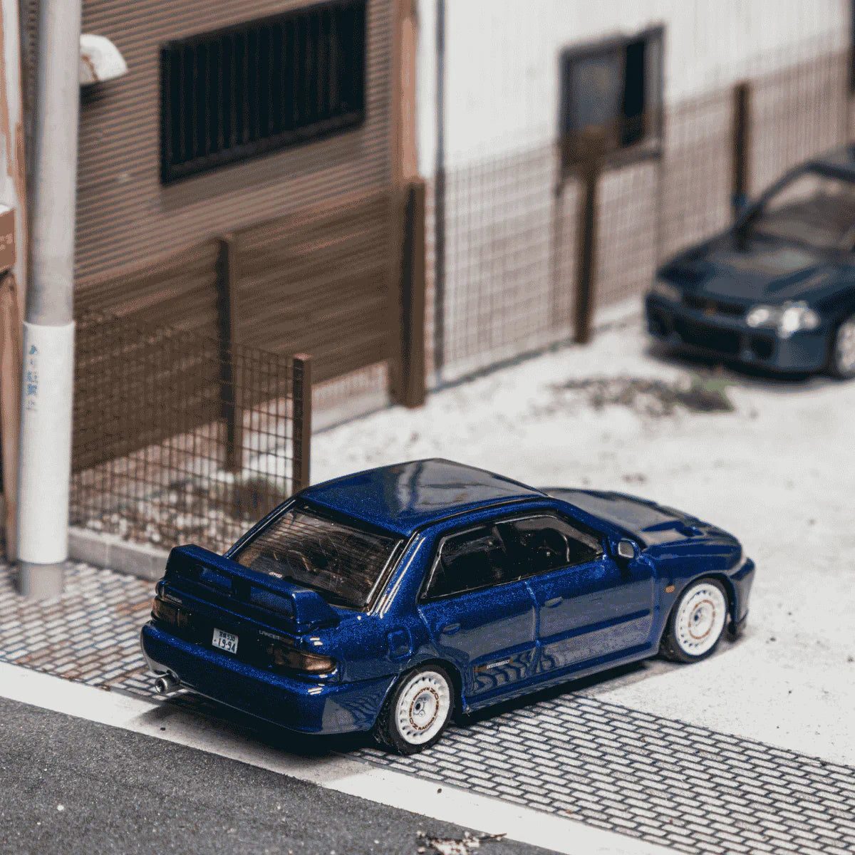 PRE-ORDER Tarmac Works Mitsubishi Lancer GSR Evolution II Chance of Chase Car, 1:64 Scale (Blue)